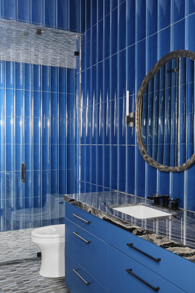 Blue bathroom setting with blue tile and vanity