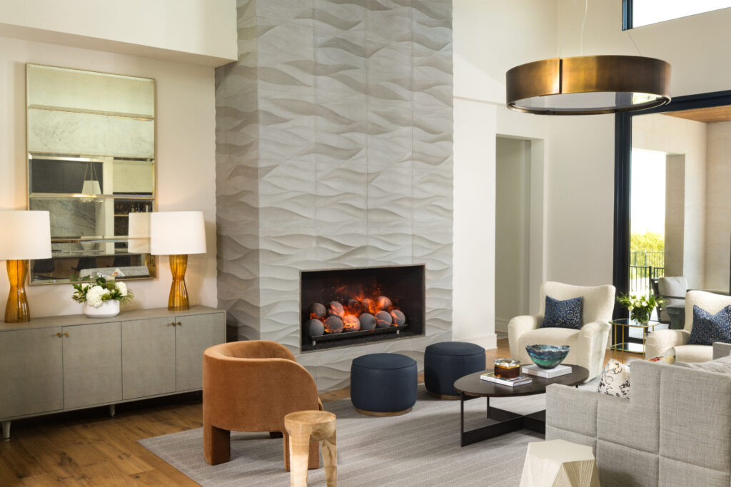 Living room with tiled fireplace surround and modern decor and furniture