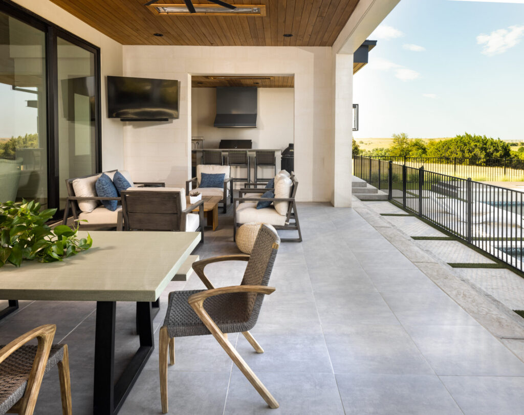 covered back patio with tile and furniture