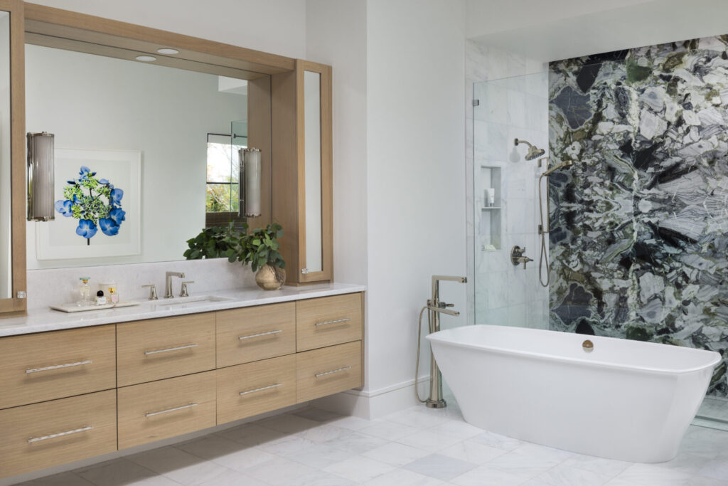 bathroom setting with white and wood tones and colorful modern tile wall