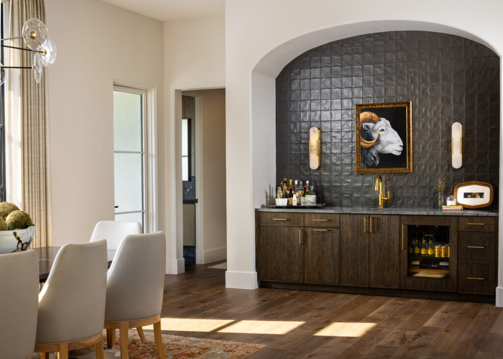Kitchen with wet bar with dark tile wall in a modern setting