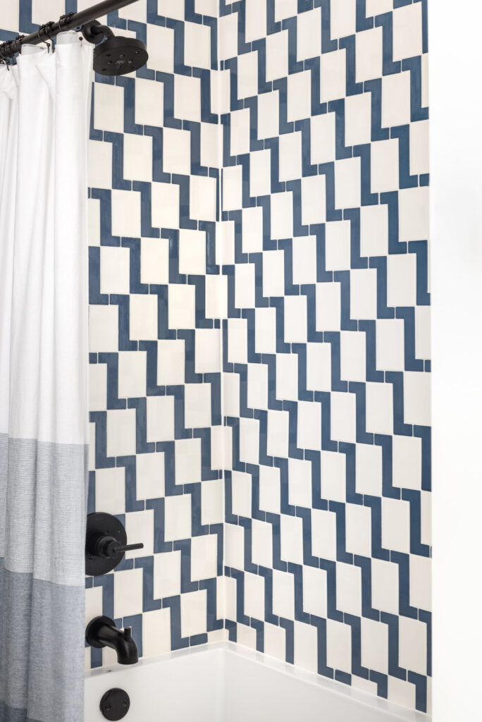 bathroom blue and white tile tub surround