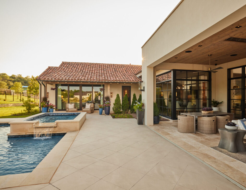 Exterior of house with pool and tile porch