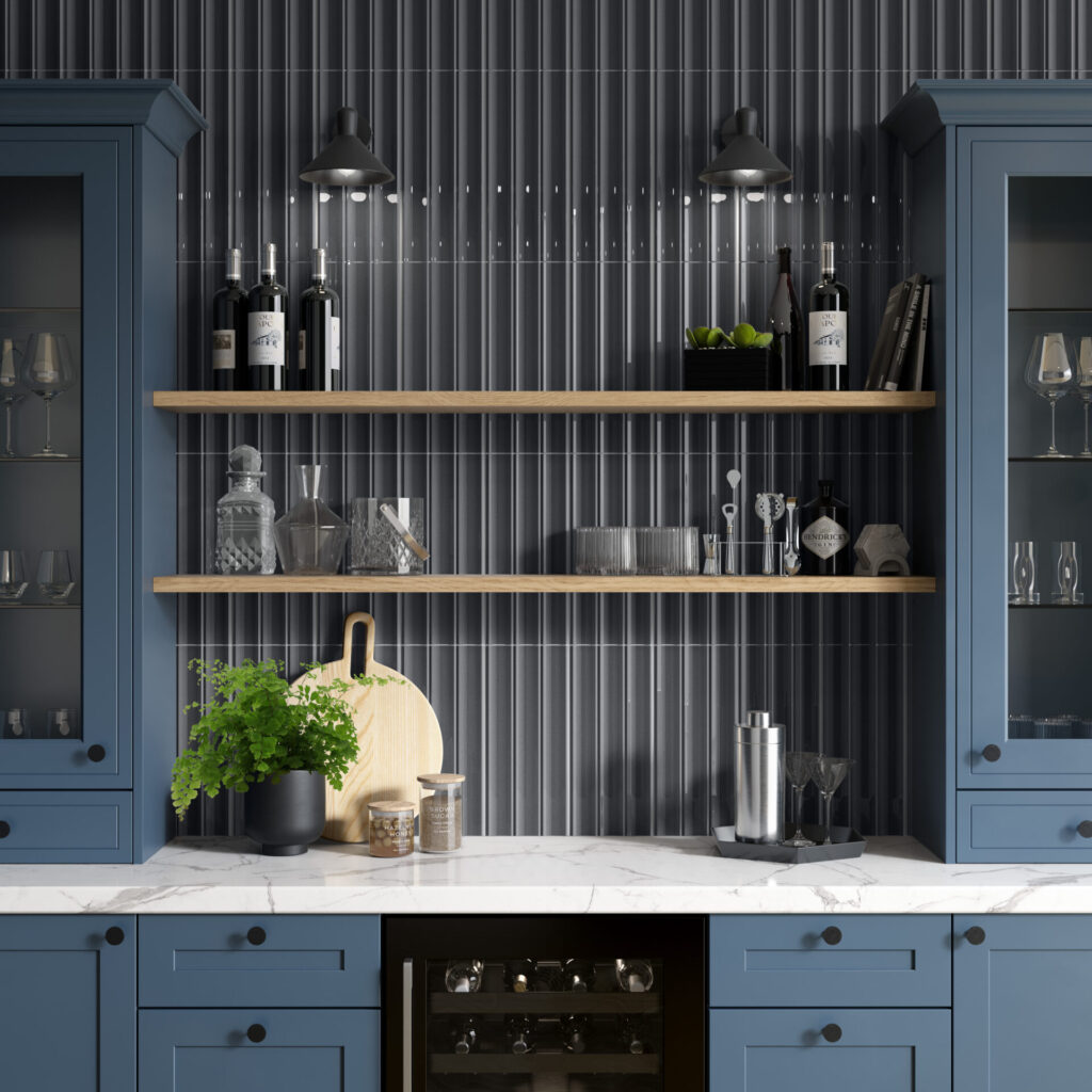 TUBAGE™ 7" x 16" pewter sample on wall with blue cabinets